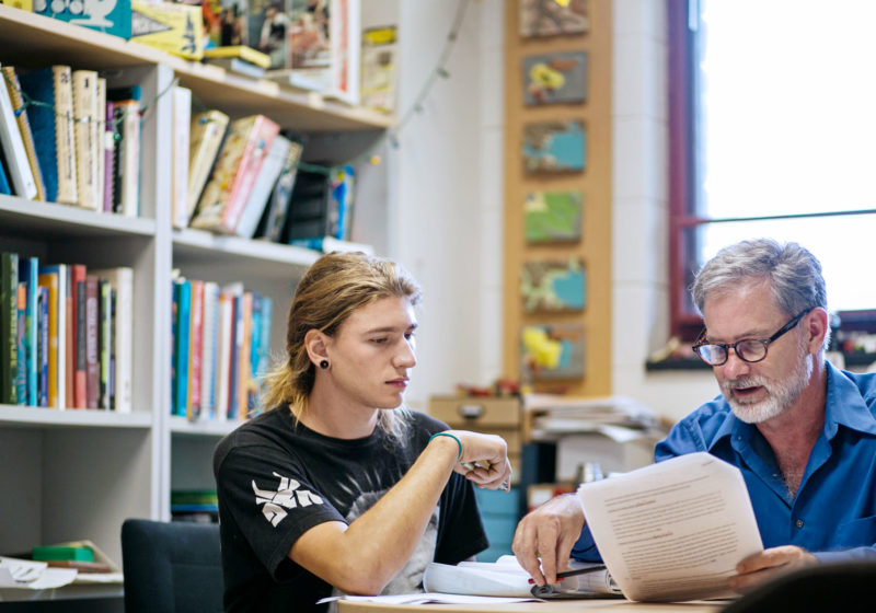 Professor Jeff Holmes meeting with student