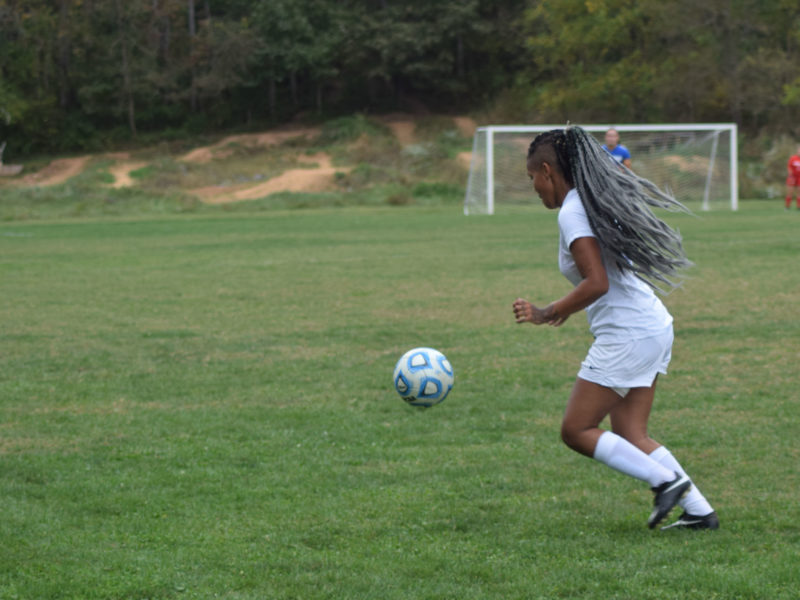 Student playing soccer