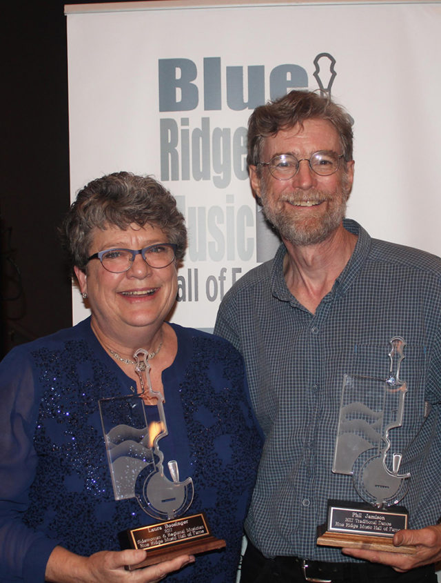 Warren Wilson College math and music professor Phil Jamison and alumna Laura Boosinger celebrate their induction into the Blue Ridge Music Hall of Fame.