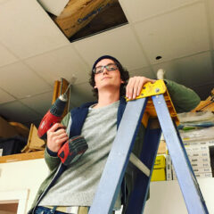 student working with drill