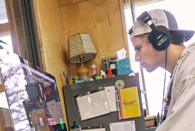 student editing video on computer