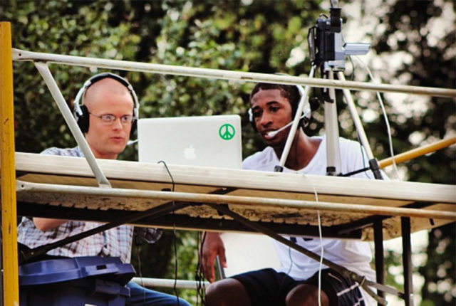 Students keep the score at a game