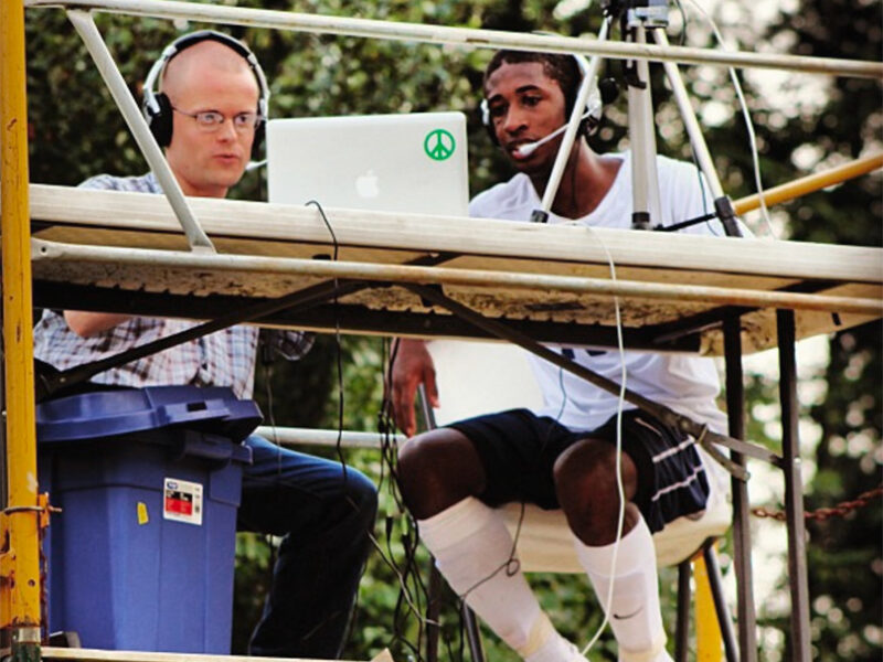 Students keep the score at a game