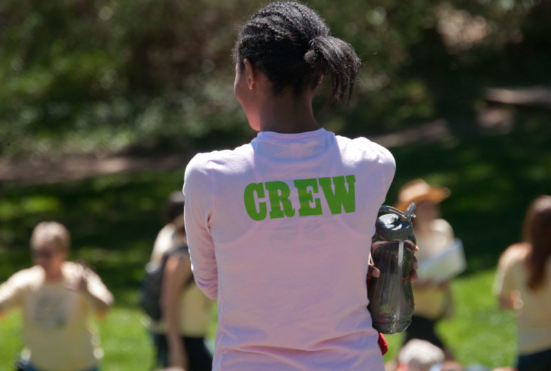 woman with crew on her shirt