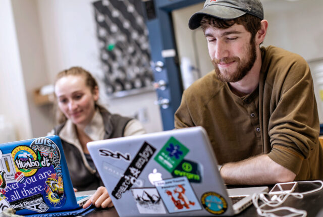 Two students on laptops