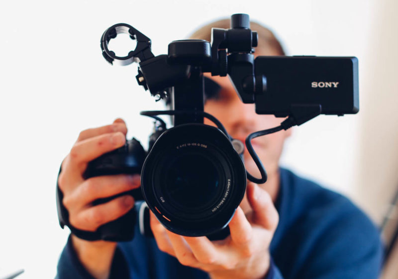 man with video camera