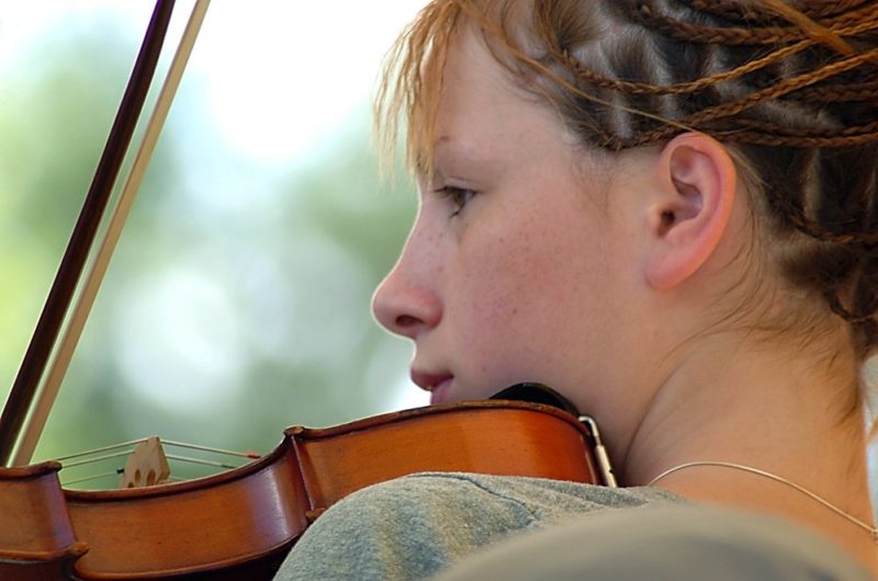 Girl playing a fiddle