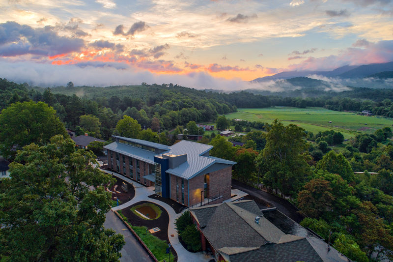 An aerial view of Myron Boon Hall with the backdrop of the swannanoa valley.