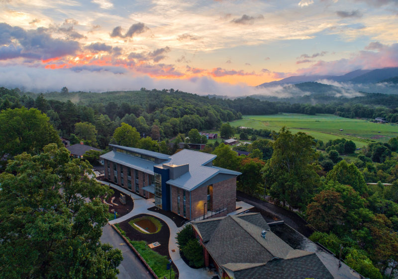 An aerial view of Myron Boon Hall with the backdrop of the swannanoa valley.