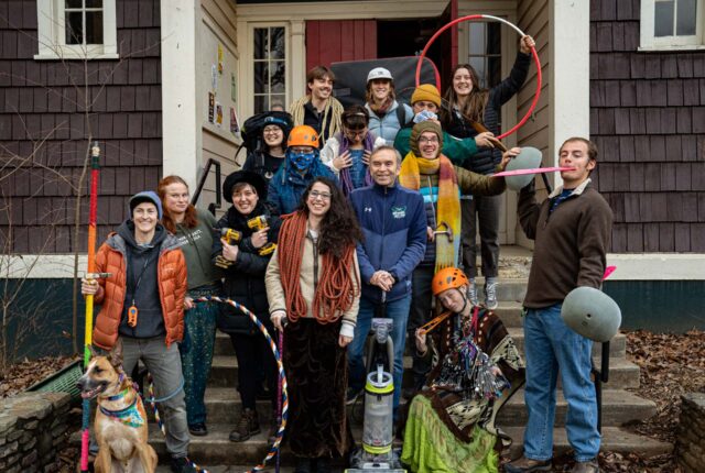 Adventure Programs Crew Members and Supervisor stand with gear in hand posing and smiling