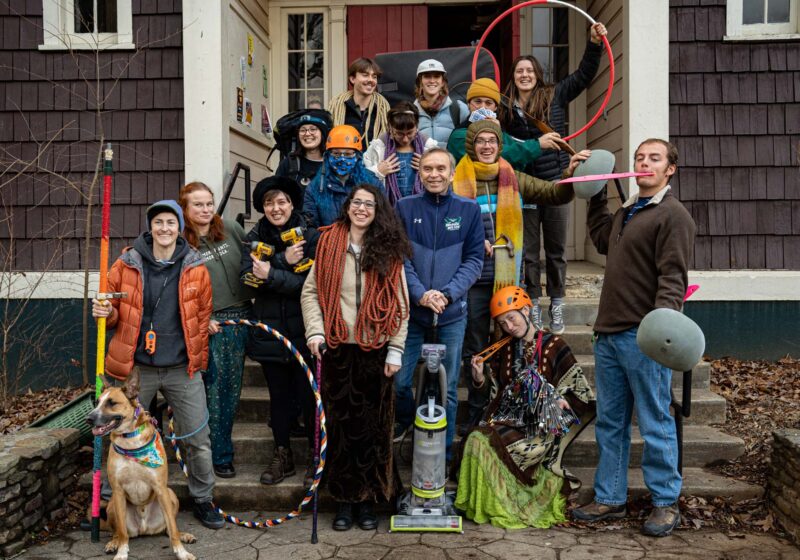 Adventure Programs Crew Members and Supervisor stand with gear in hand posing and smiling