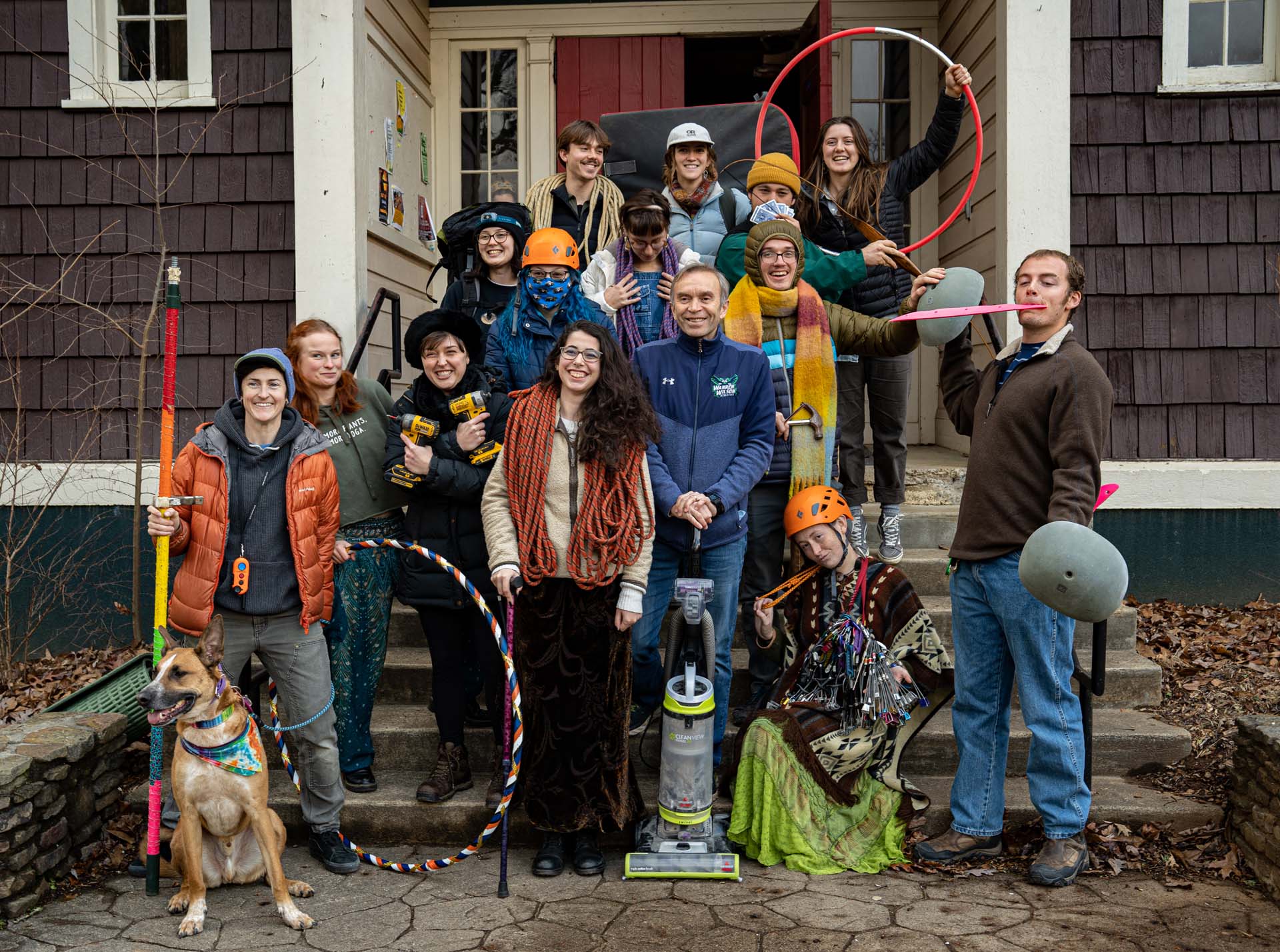 Adventure Programs Crew Members and Supervisor stand with gear in hand posing and smiling