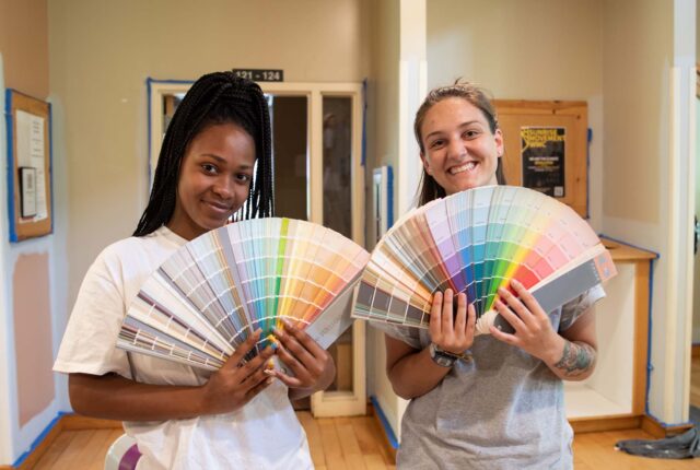 Paint Crew students posing with paint swatches