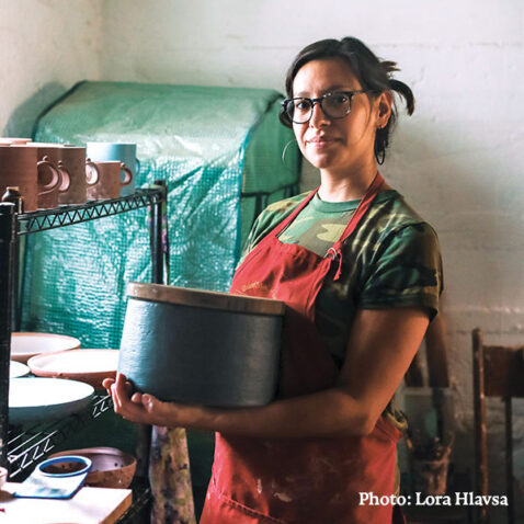 Alum Wendy Eggerman stands in her ceramic studio