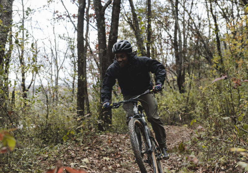 Student Monte Cosby smiles as his turns down a bike trail.