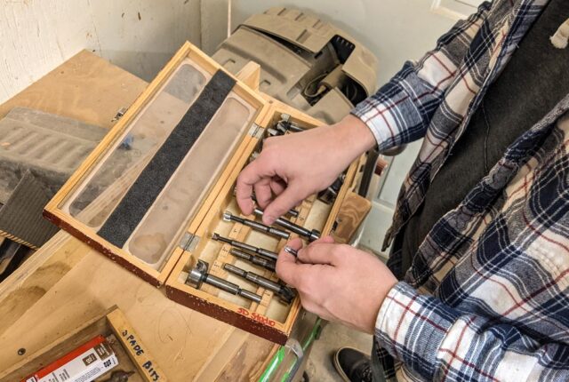 A student picks up some drill bits