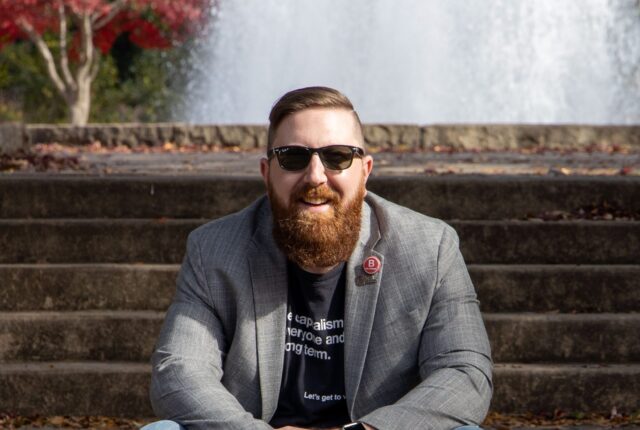 Nathan Stuck, Board Chair of B Local Georgia and CEO and Founder of Profitable Purpose Consulting, sits smiling