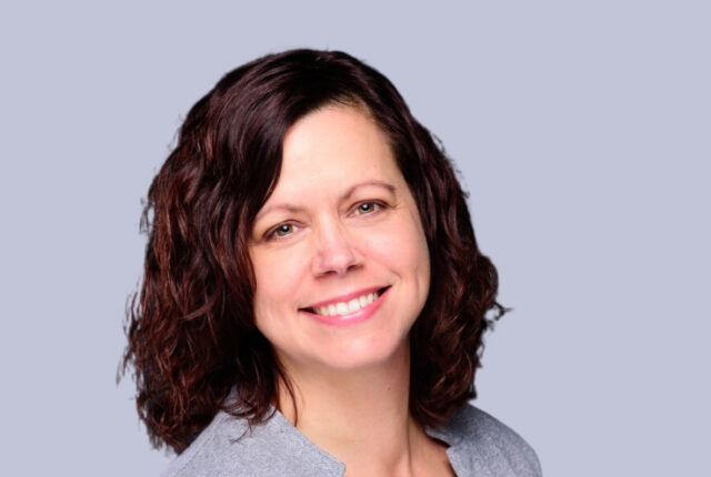 Adrianne Gordon, WWC ’99 Alumna, Board Chair of B Local Asheville, COO at Big Path Capital, and Founder of Practical Insight stands smiling