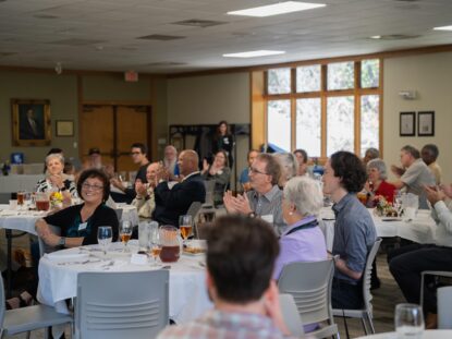 Alumni gather at tables for the alumni awards