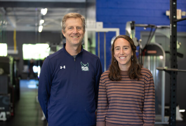 Psychology Professor Bob Swoap and Alum Marisa Romeo '15 stand smiling for a picture.