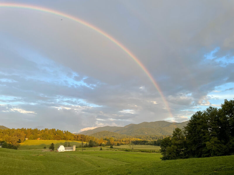 A rainbow over the white barn at Warren Wilson College.