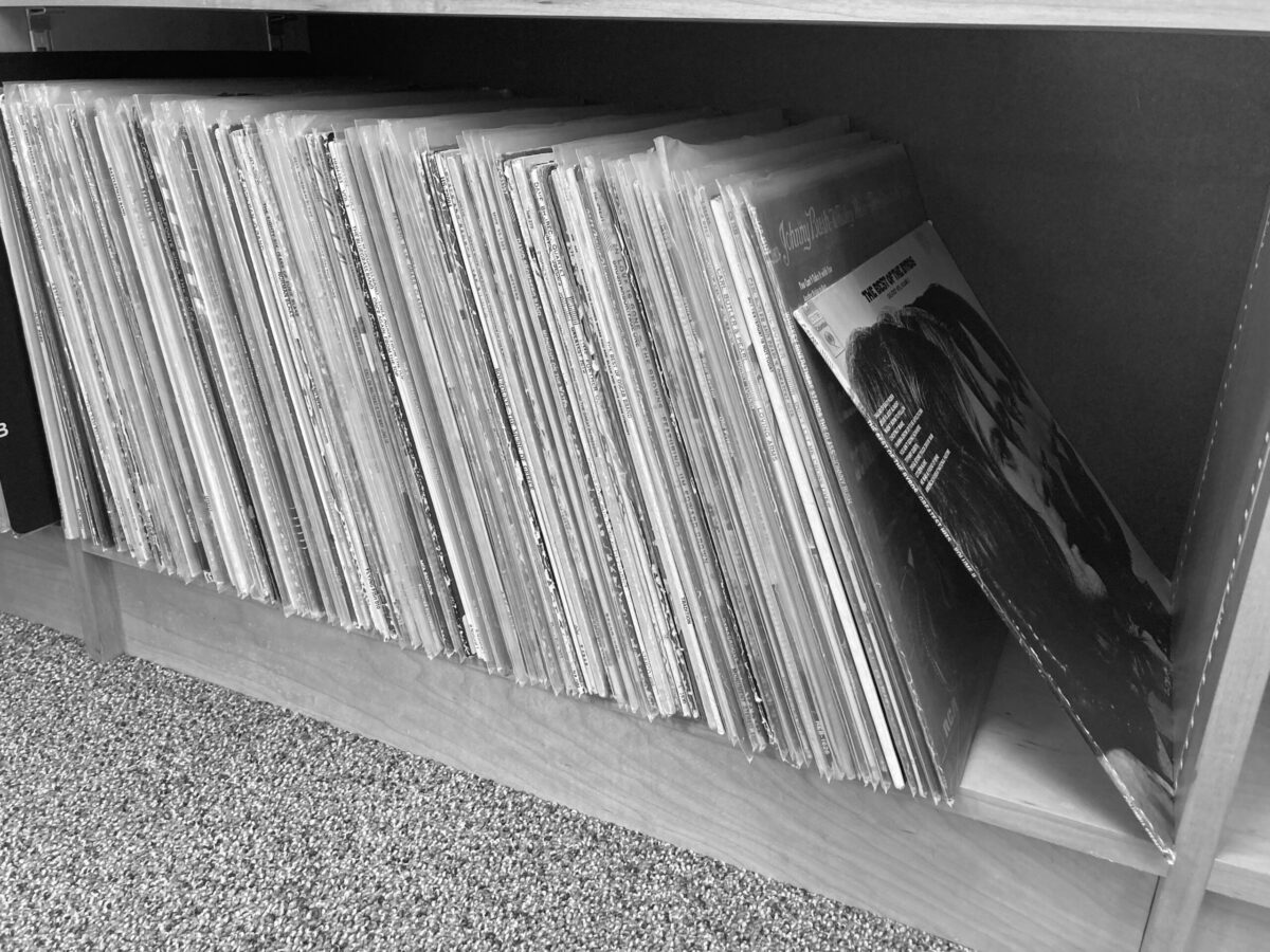 Black and White image of vinyl records on a shelf