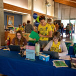 Student leaders check students in for move in