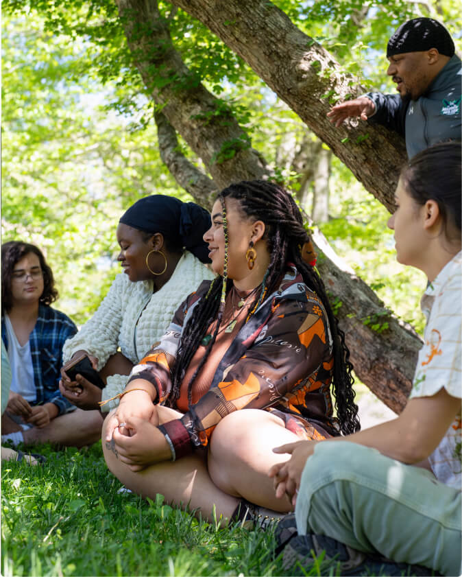 Students on the Wilson Inclusion, Diversity, and Equity, or WIDE, crew sit outside for their meeting.
