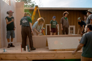 Students work on tiny home construction