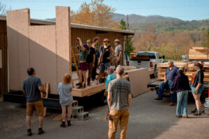 students work on tiny home construction