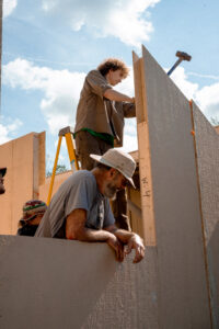 students work on tiny home construction