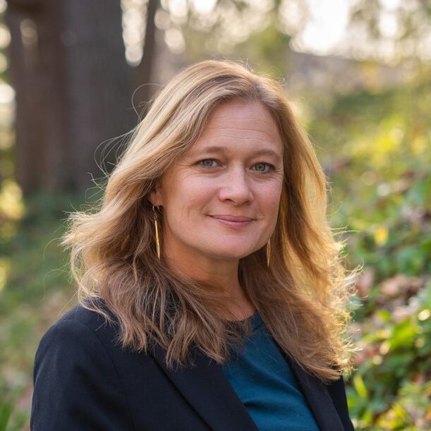 Executive Director of Strategic Ventures, Partnerships and Programs, Amy Ager, stands smiling.