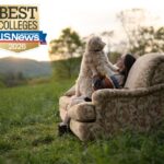 A student on a couch in dogwood pasture with their dog. Overlaid on the picture is a seal from US News and World Report Naming Warren Wilson College a 2026 Best College