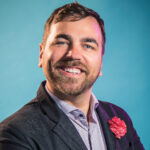 Future Provost Brian Norman stands smiling for a headshot