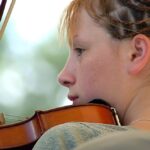 Girl playing a fiddle