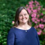 Warren Wilson Professor Dr. Liesl Peterson Erb stands and smiles for a headshot.