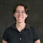 Professor of Biology Elizabeth Green smiles for a headshot photo.